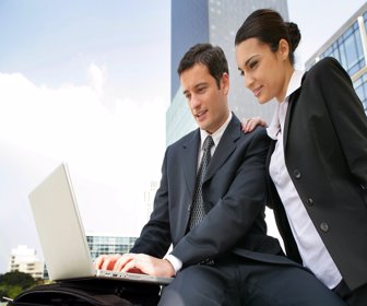 13828264 - businessman and businesswoman working outdoors