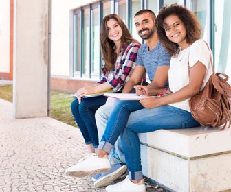 Students sharing notes in the university campus