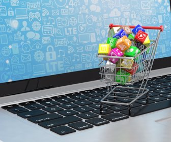 shopping cart with application software icons on laptop