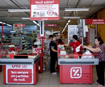 customers at a cashier at a Dia Market , Sao Paulo, Brazil , March 8th , 2010