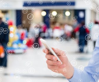 digital composite of hand holding smartphone with vignettes