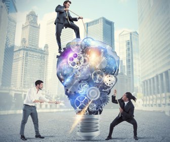 Teamwork of businesspeople work together to a lightbulb system of gears