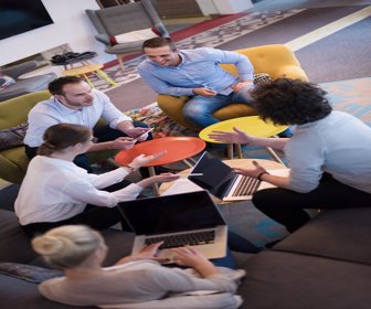 Startup Business Team At A Meeting at modern office building
