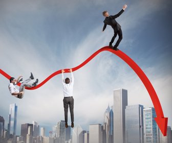 Businessmen falling down toward the economic crisis