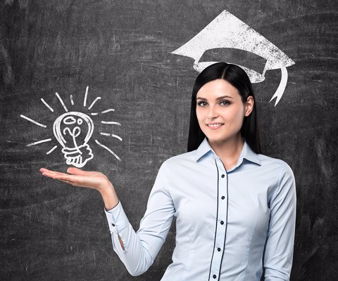 Brunette lady presents a light bulb as a concept of university degree. Graduation hat is drawn above her head.
