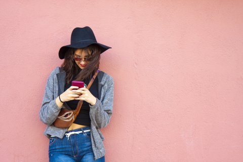 girl with smartphone on street